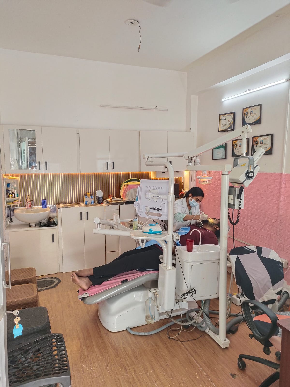 Dentist treating a patient in the treatment room